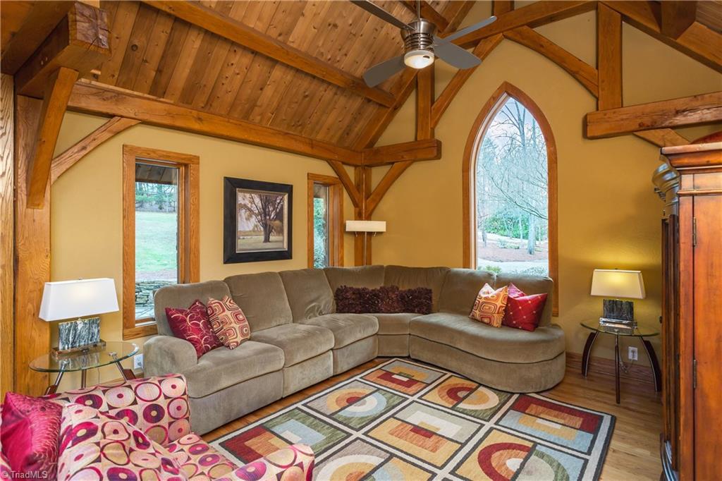 6111 Meadow Bluff Lane Oak Ridge, NC 27310 - Photo 14 of 30 The den is really great. Brilliant display of the post and beam construction enhanced by the gothic window centered on the gable end. This flexible space is open to kitchen, keeping and dining areas.