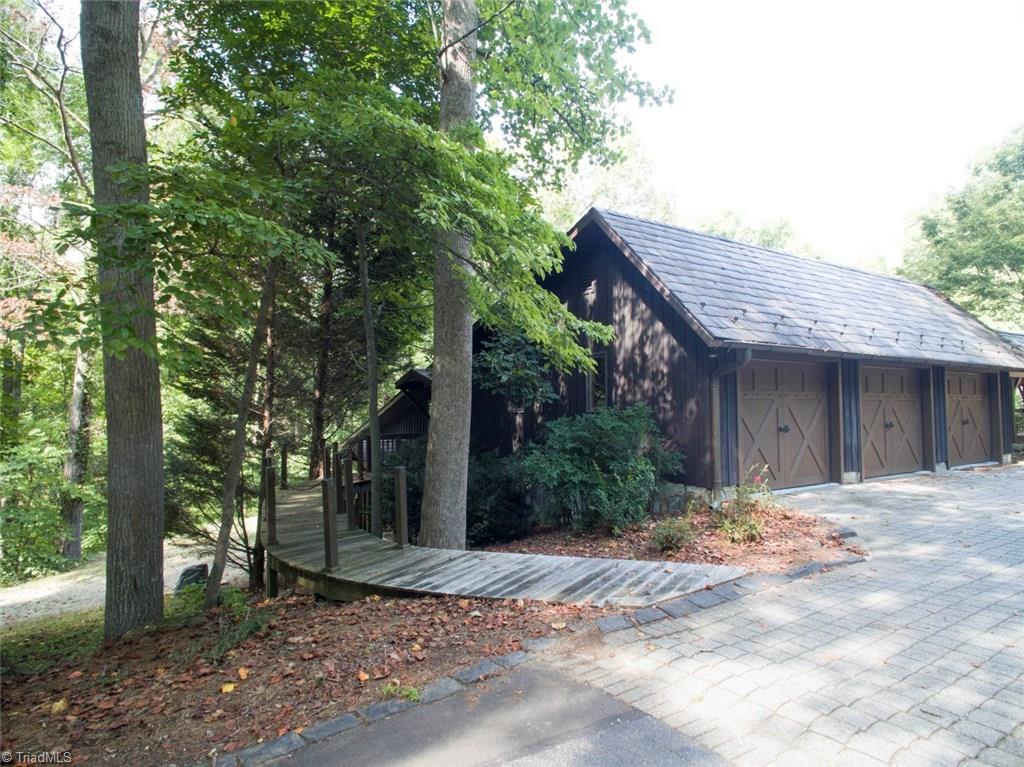 6111 Meadow Bluff Lane Oak Ridge, NC 27310 - Photo 5 of 30 The garage has three independent doors allowing for a very spacious interior. The driveway apron is Johnson pavers with a charming walkway leading to the second level entrance of the guest quarters.