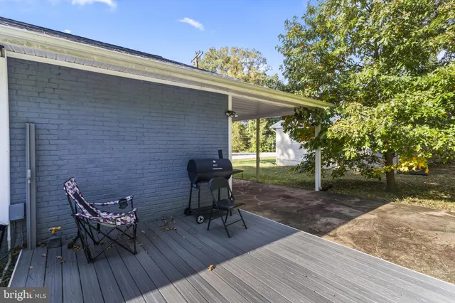 a view of a chairs and table on the deck with wooden floor