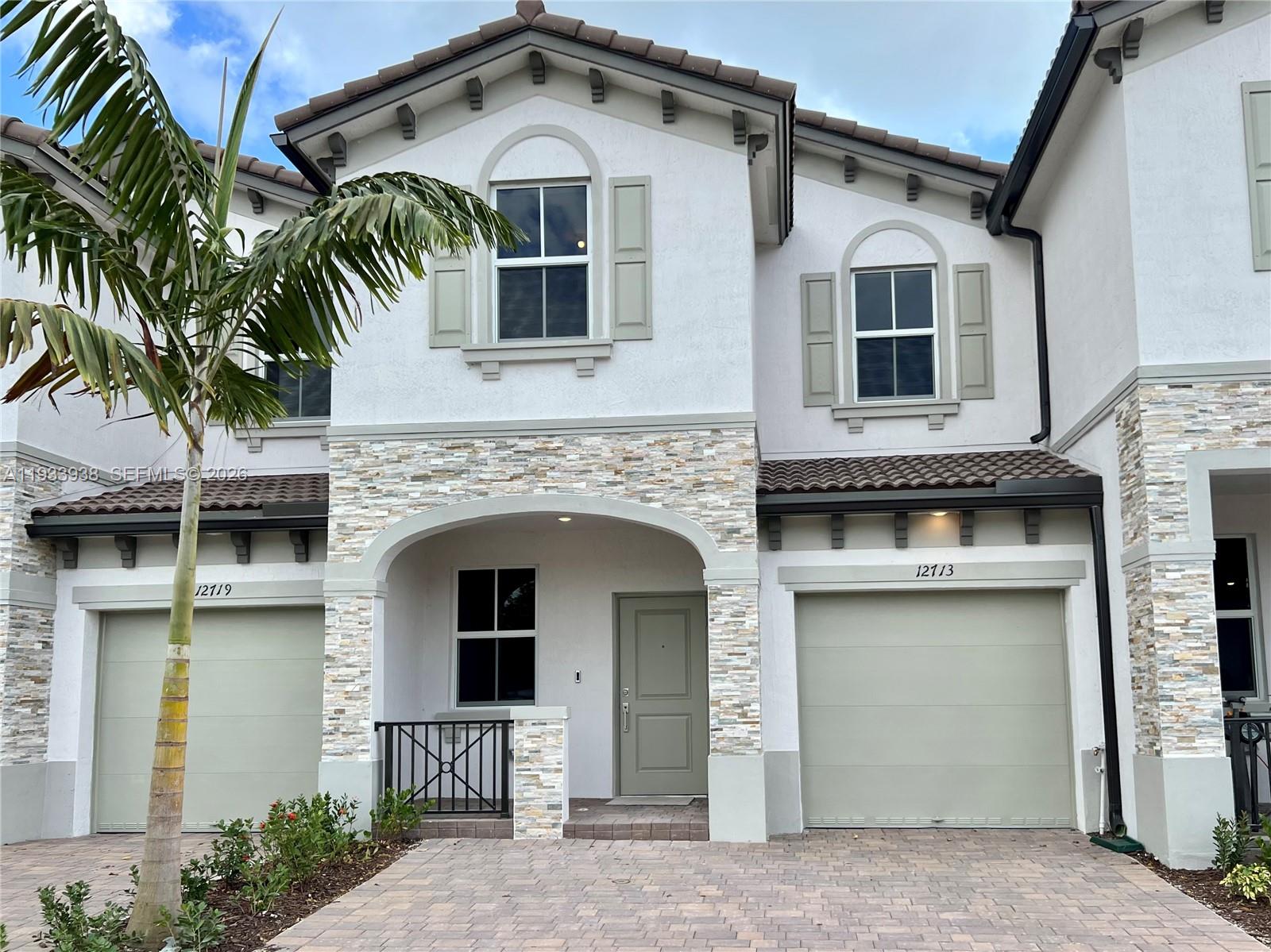 12713 Northwest 24th Avenue Miami, FL 33147 - Photo 1 of 50 a front view of a house with balcony