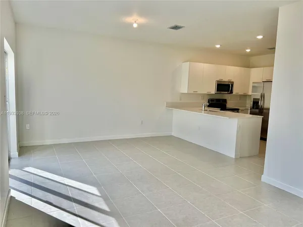 an empty room with closet area