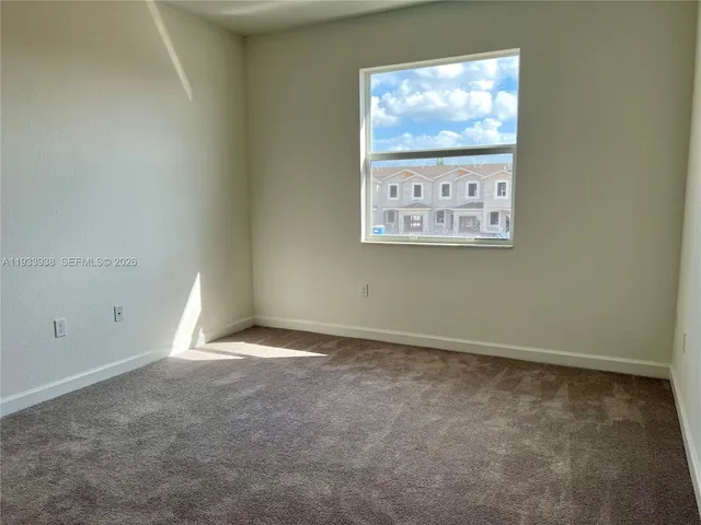 an empty room with closet area