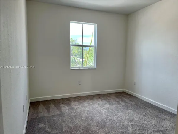 a view of a room with an empty space