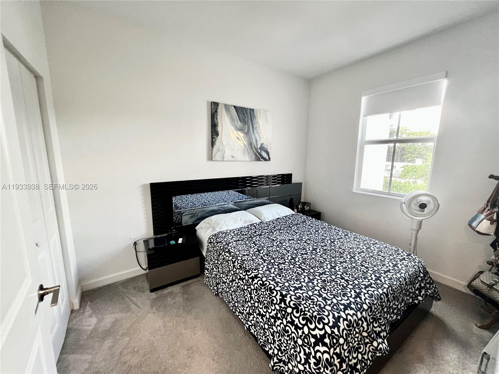 12713 Northwest 24th Avenue Miami, FL 33147 - Photo 30 of 50 a bedroom with bed and window