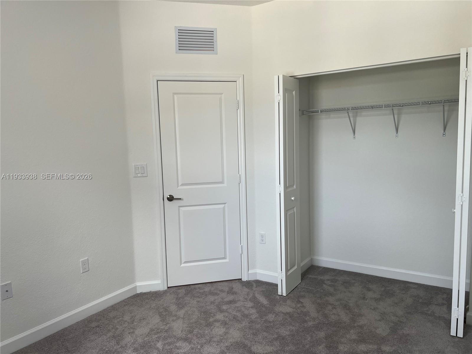 12713 Northwest 24th Avenue Miami, FL 33147 - Photo 31 of 50 an empty room with closet area