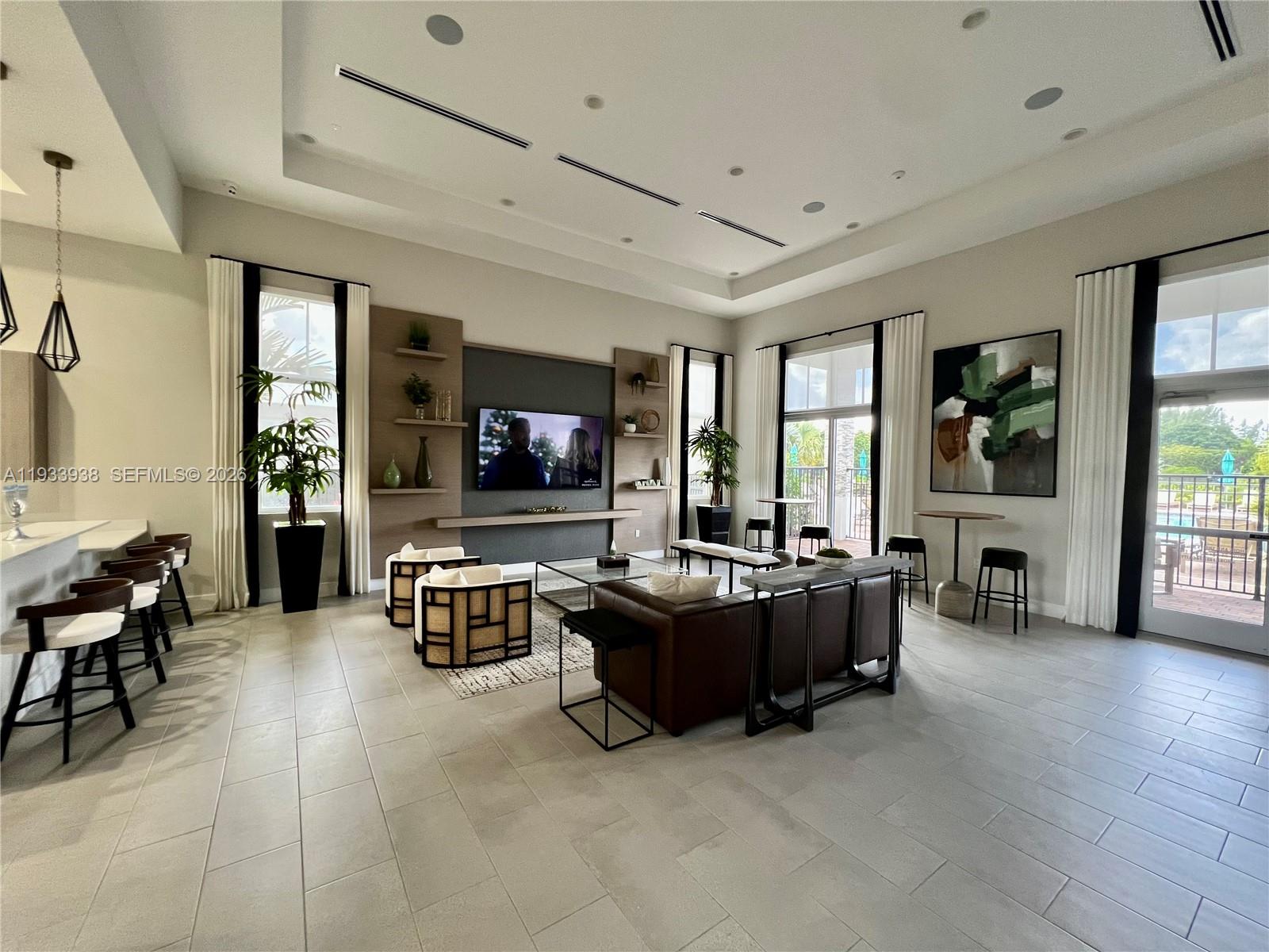 12713 Northwest 24th Avenue Miami, FL 33147 - Photo 39 of 50 a living room with furniture and a flat screen tv
