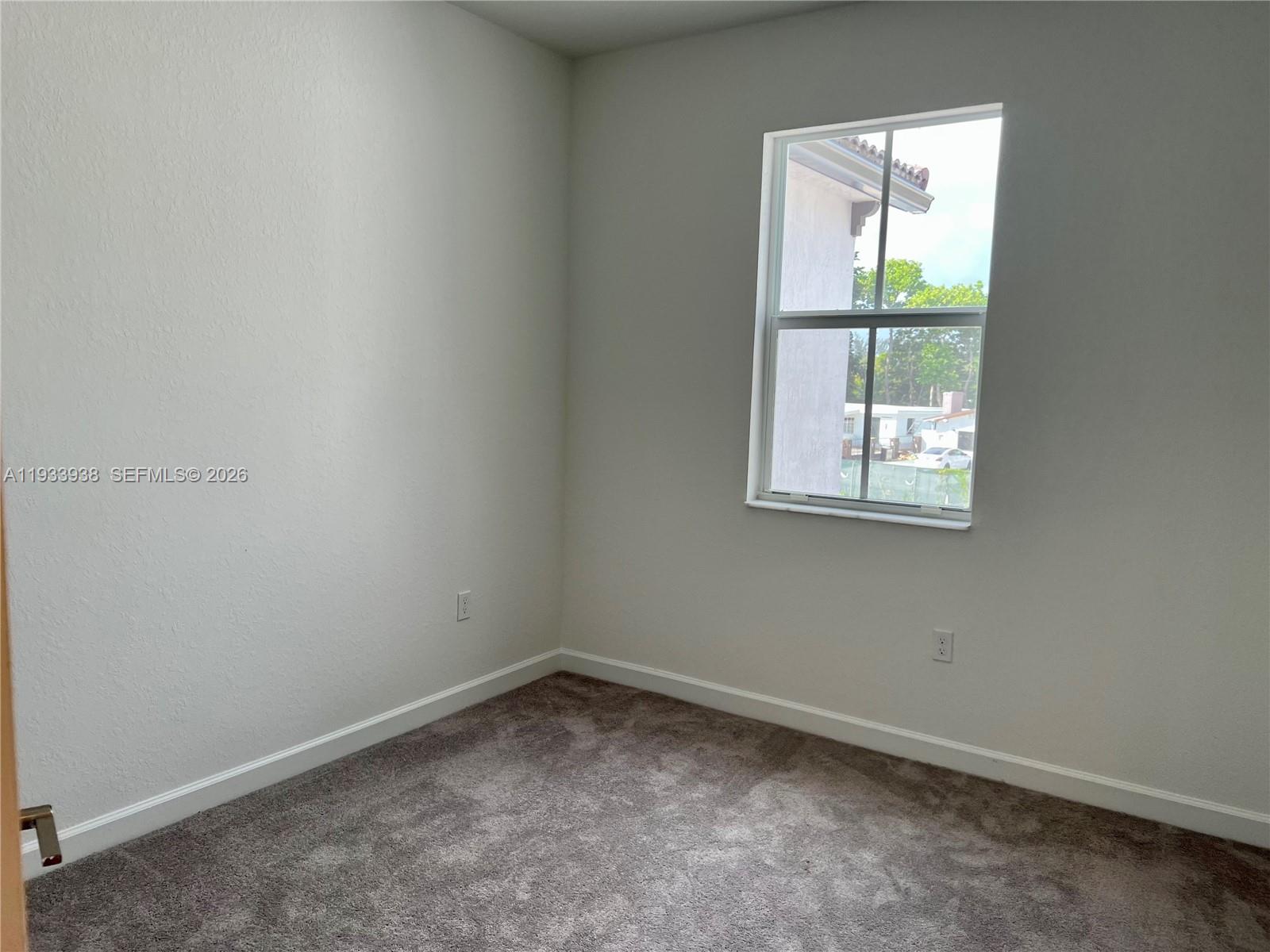 12713 Northwest 24th Avenue Miami, FL 33147 - Photo 50 of 50 an empty room with a window