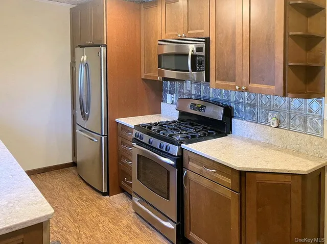 a kitchen with a stove microwave and refrigerator