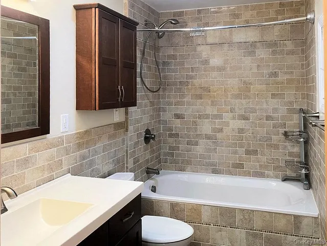 a bathroom with a sink and a bathtub