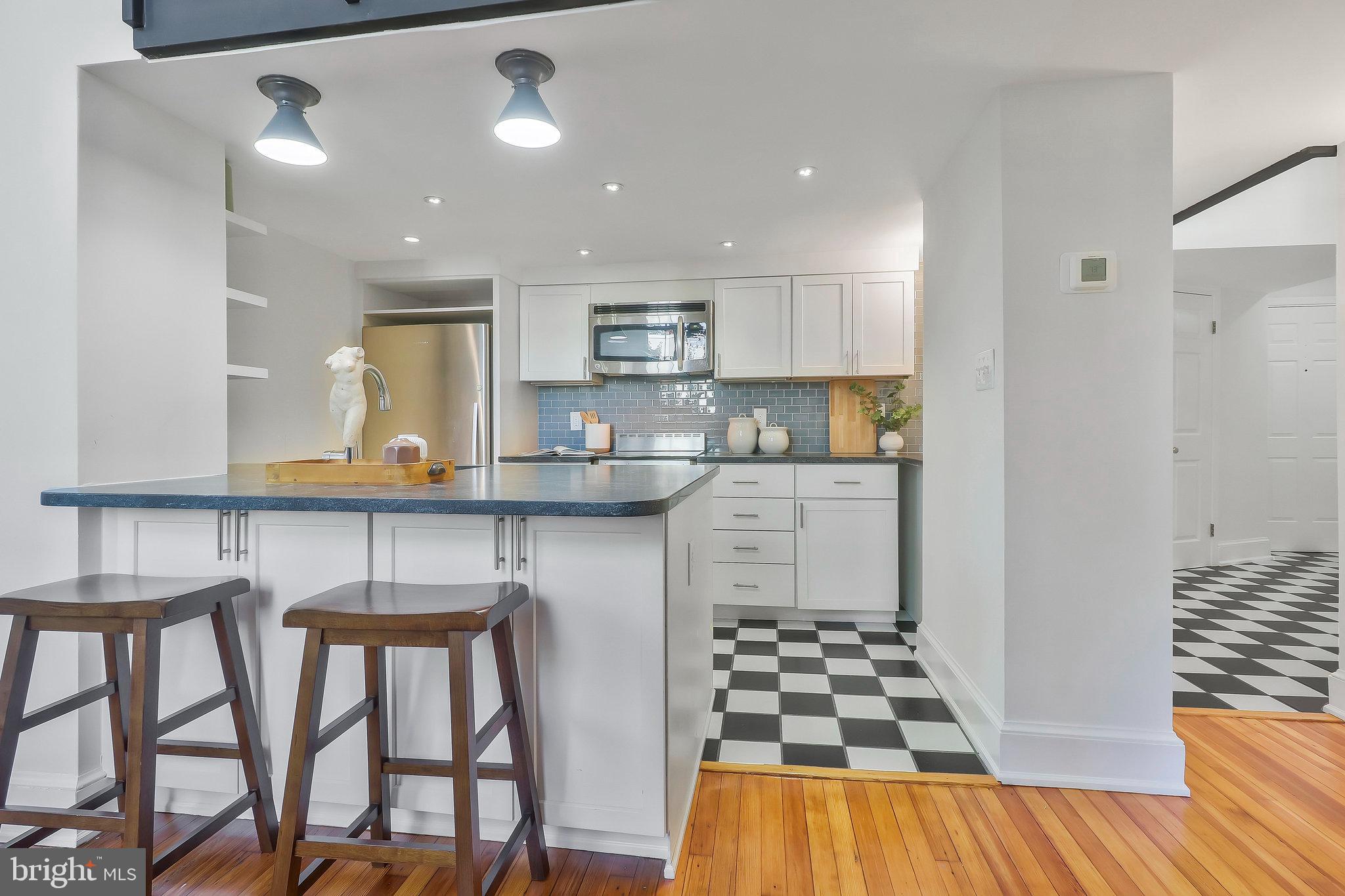 410 5th Street Northeast, Unit 14 Washington, DC 20002 - Photo 15 of 40 Kitchen with large granite breakfast bar.