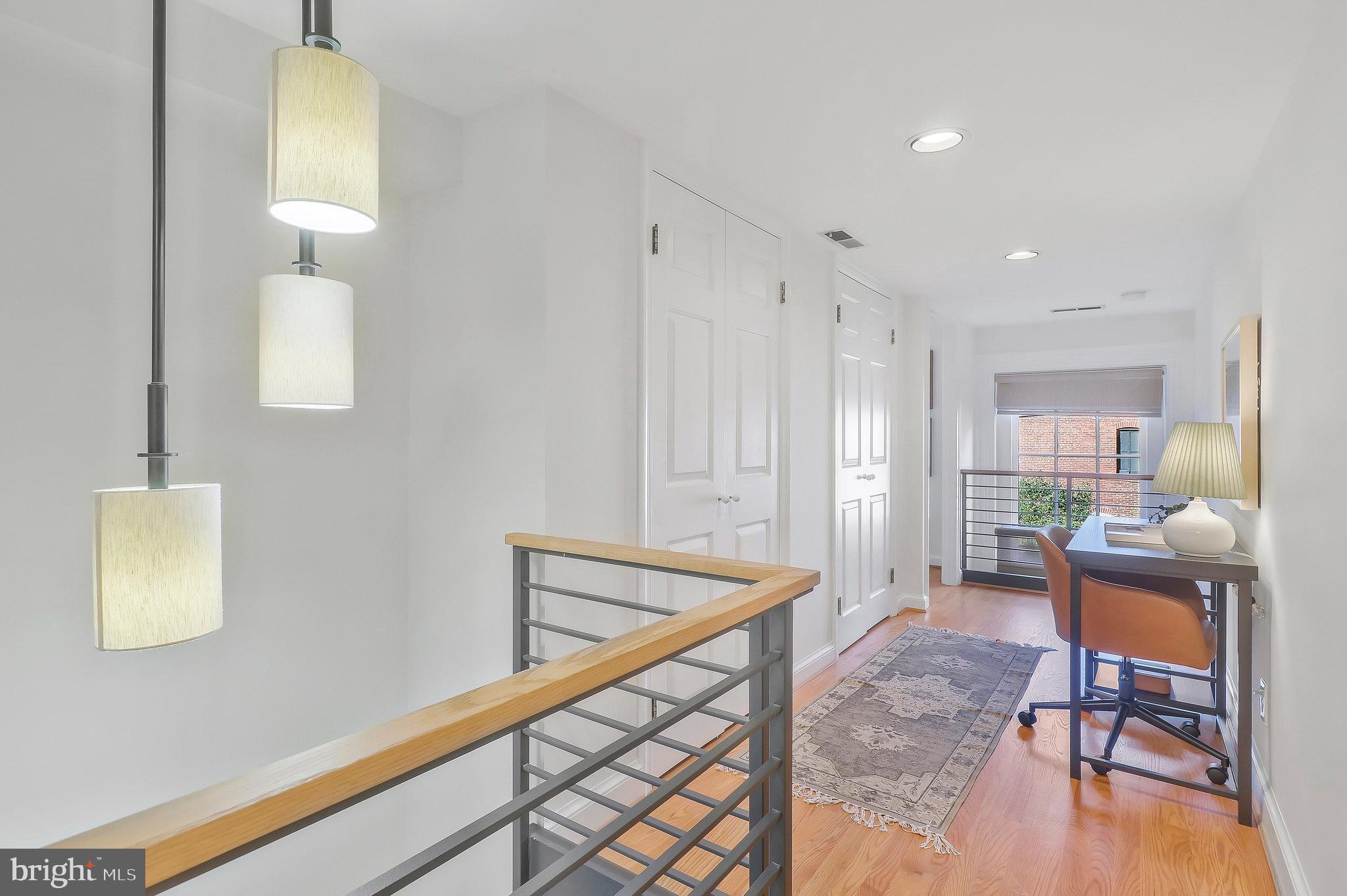 410 5th Street Northeast, Unit 14 Washington, DC 20002 - Photo 31 of 40 Wide upper hall with cut-outs overlooking below.