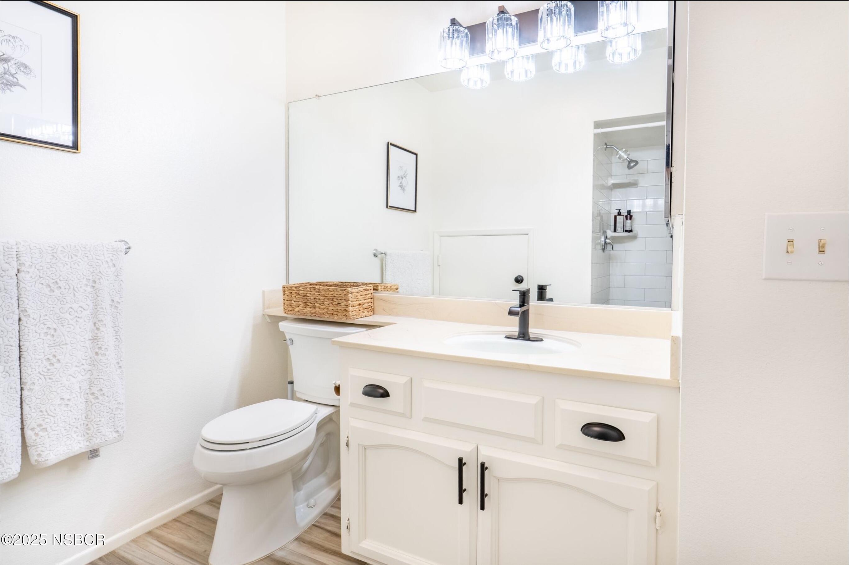 5 Stanford Circle Lompoc, CA 93436 - Photo 13 of 21 a bathroom with a sink a toilet and shower