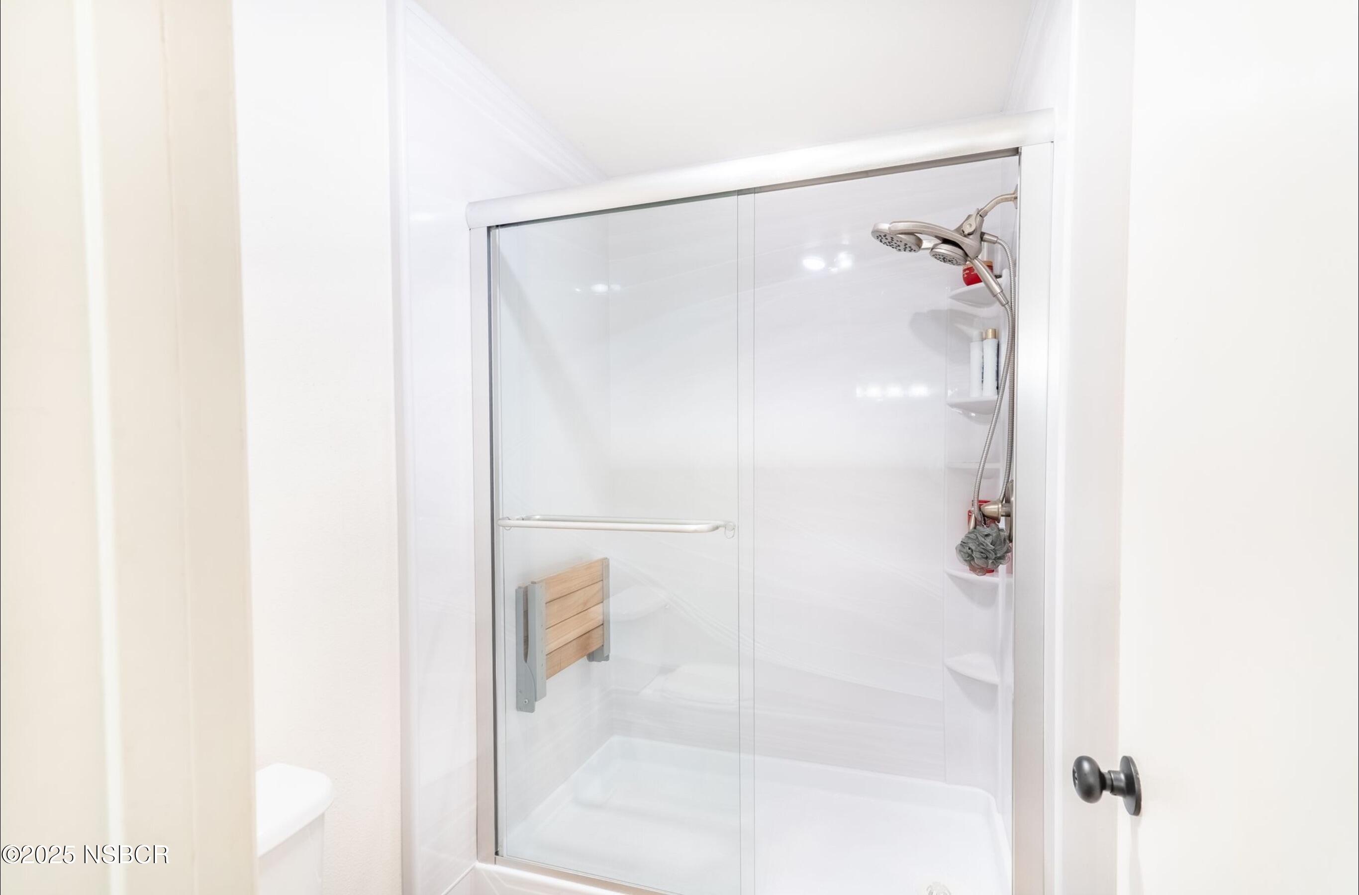 5 Stanford Circle Lompoc, CA 93436 - Photo 15 of 21 a bathroom with a glass shower door and a bathroom view