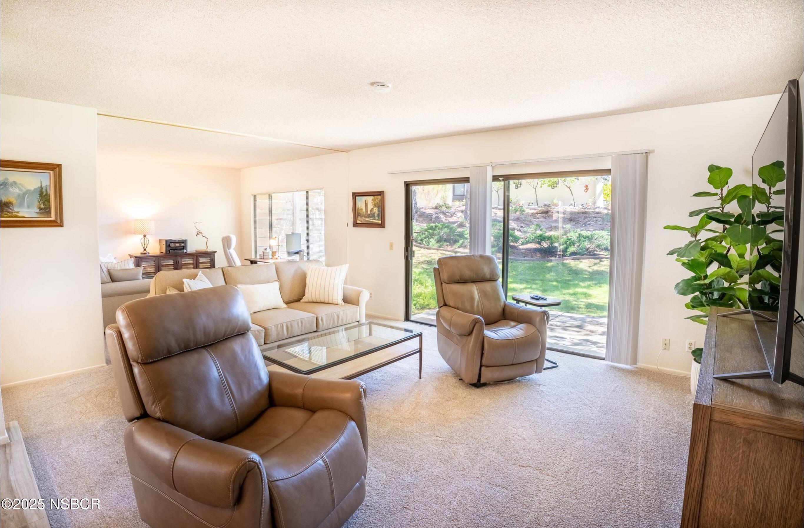 5 Stanford Circle Lompoc, CA 93436 - Photo 10 of 21 a living room with furniture and a potted plant