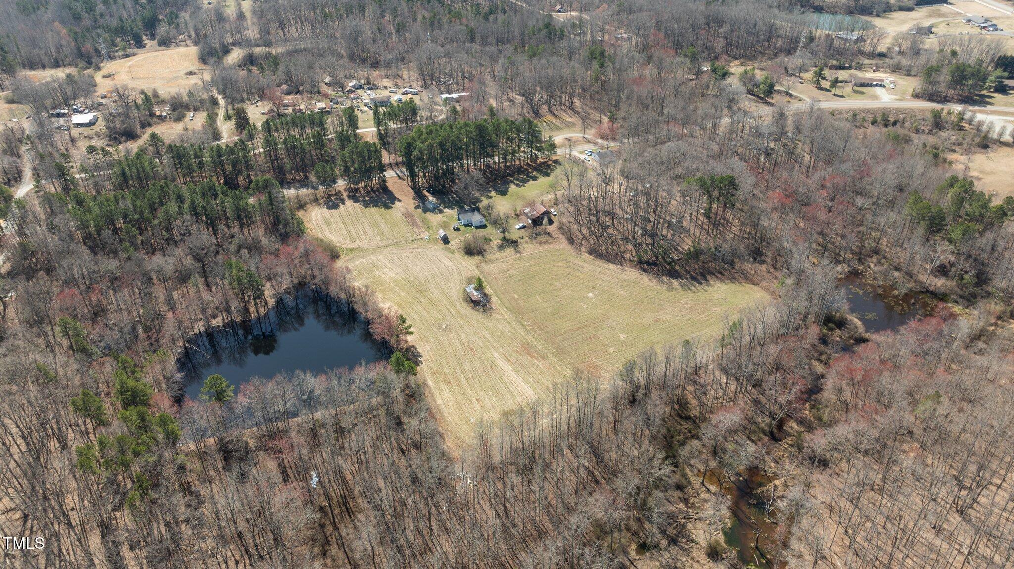2710 Morton-Pulliam Road Roxboro, NC 27574 - Photo 11 of 12 a view of a yard with trees