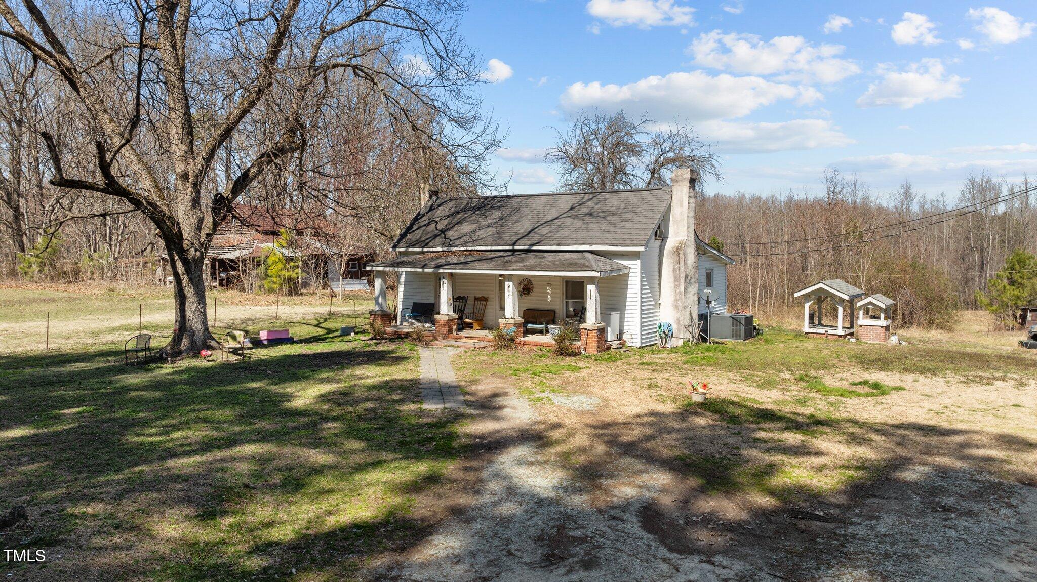 2710 Morton-Pulliam Road Roxboro, NC 27574 - Photo 2 of 12 a front view of a house with garden