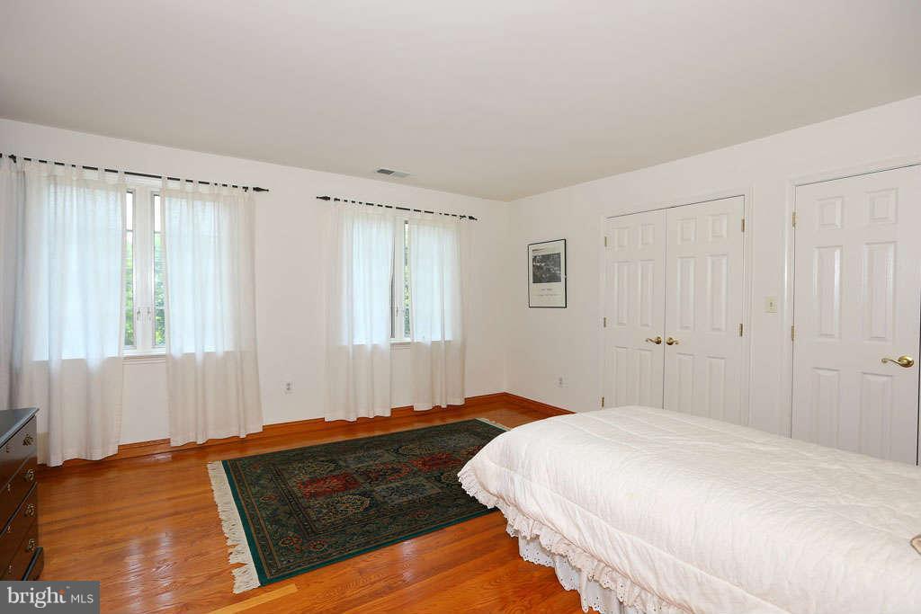 12530 Falls Road Potomac, MD 20854 - Photo 17 of 27 a bedroom with a bed and window