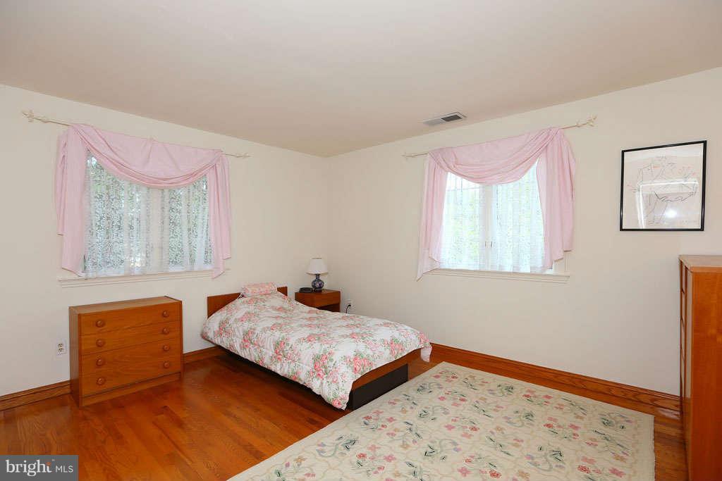 12530 Falls Road Potomac, MD 20854 - Photo 18 of 27 a bedroom with a bed and window