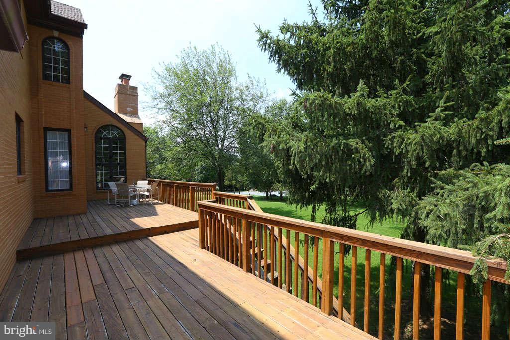12530 Falls Road Potomac, MD 20854 - Photo 24 of 27 a view of balcony with deck and wooden floor