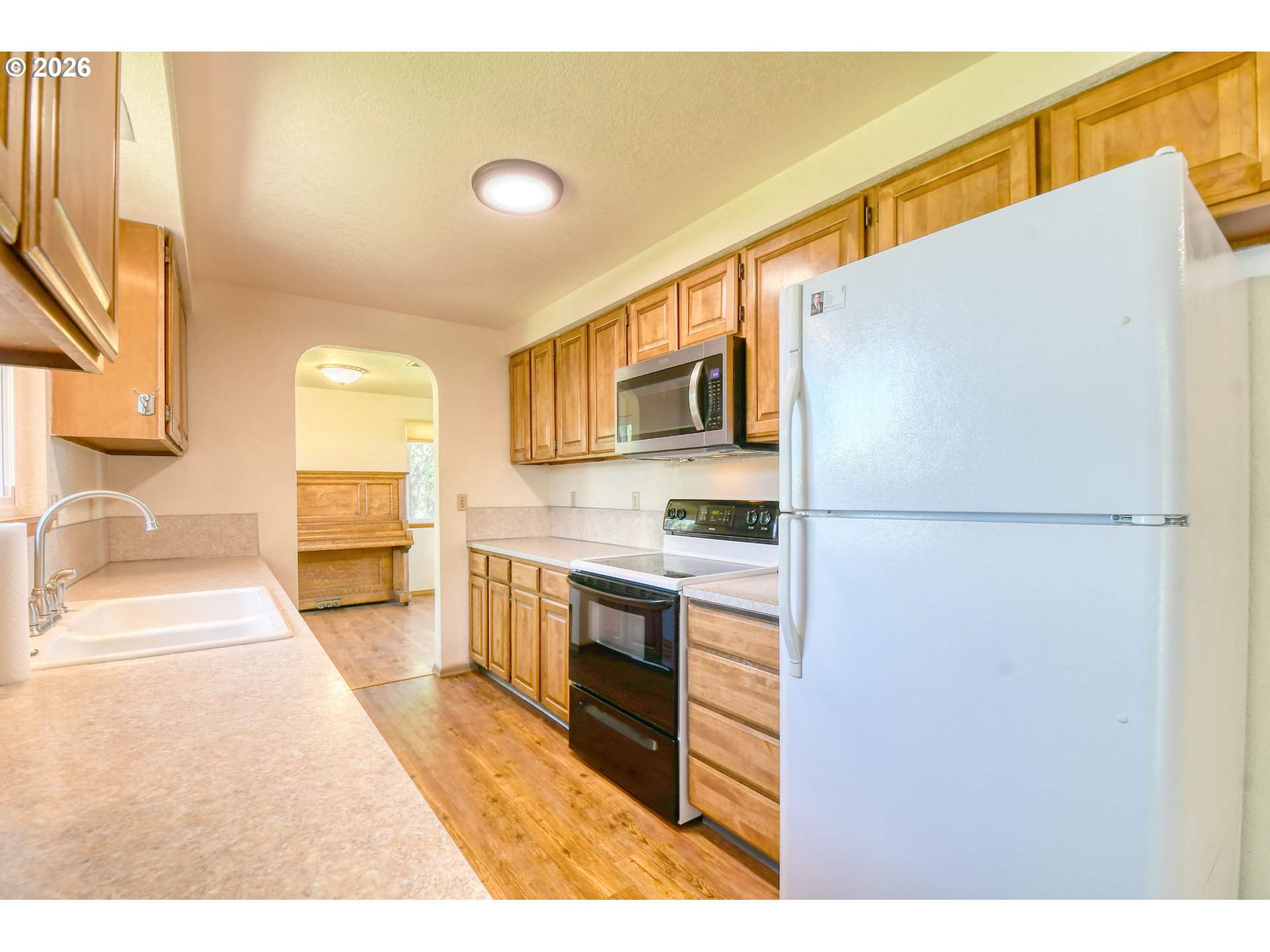 1107 Southwest 23rd Street Pendleton, OR 97801 - Photo 18 of 42 a kitchen with stainless steel appliances granite countertop a refrigerator a stove and a sink