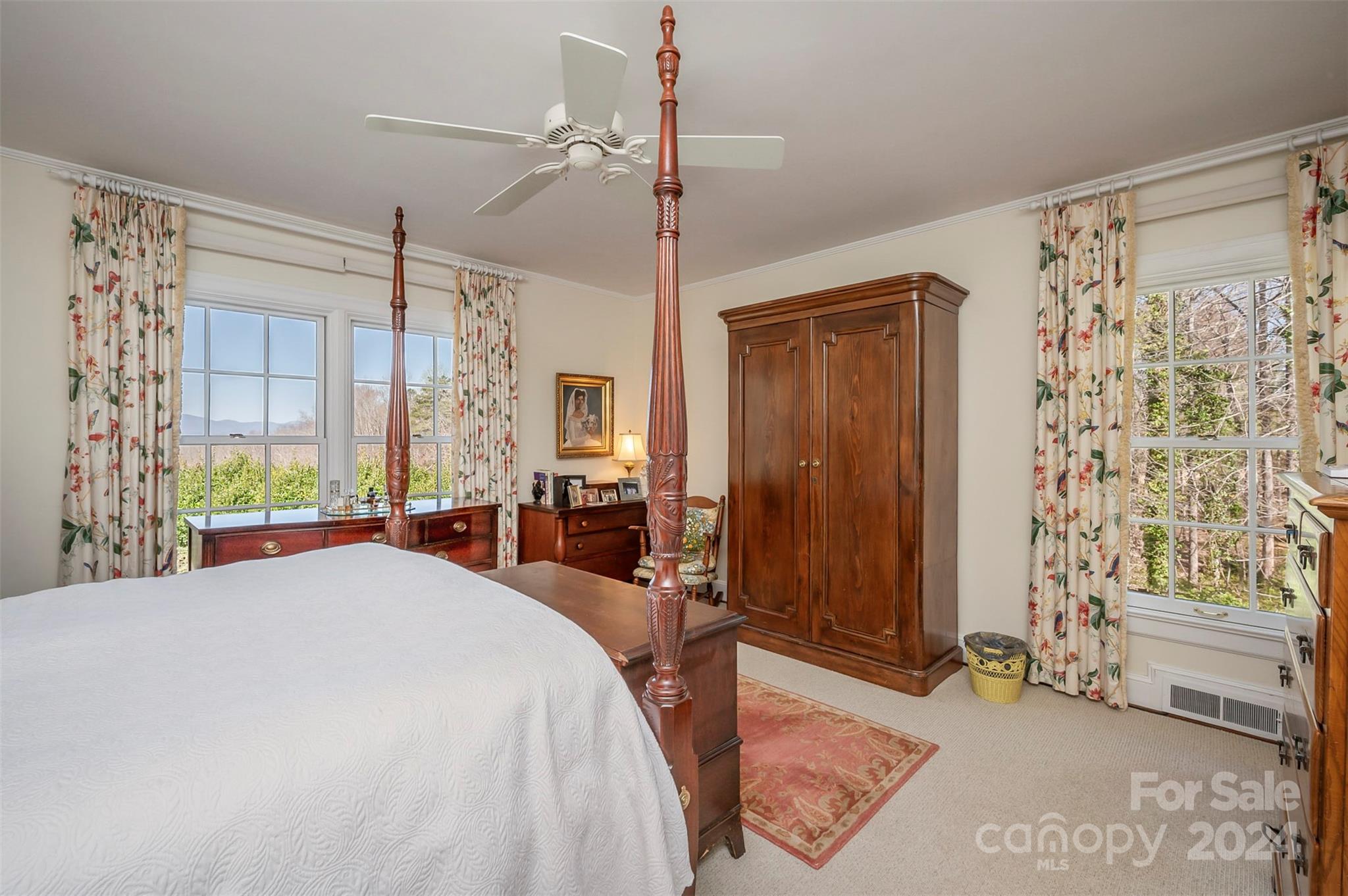 720 New Hope Road Rutherfordton, NC 28139 - Photo 27 of 44 a bedroom with a bed and a chandelier