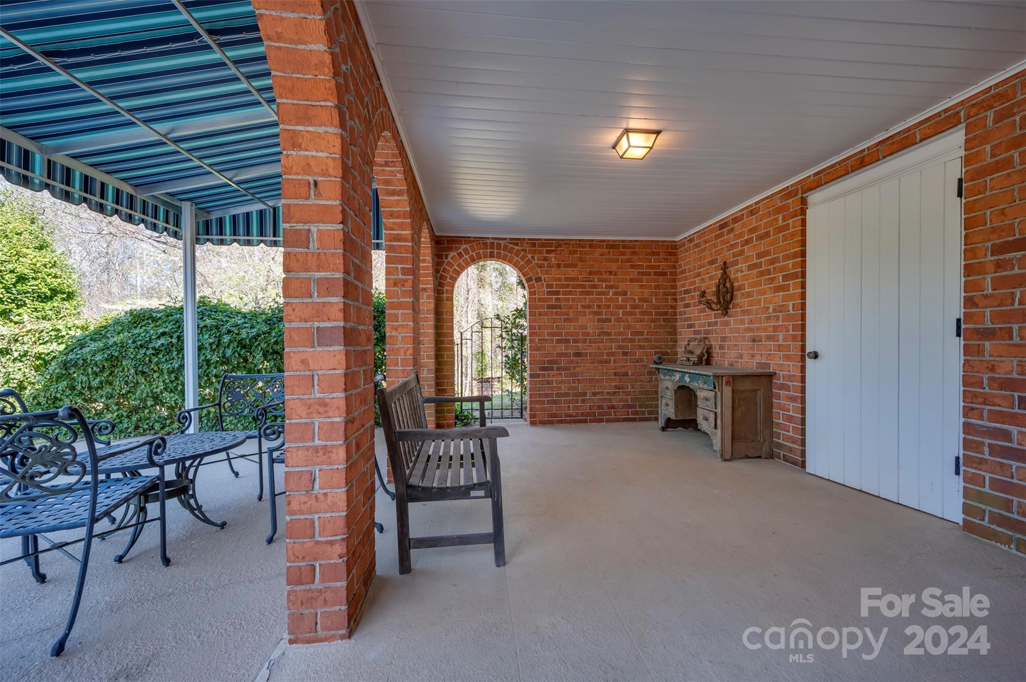 720 New Hope Road Rutherfordton, NC 28139 - Photo 34 of 44 a view of a chairs and table in a patio