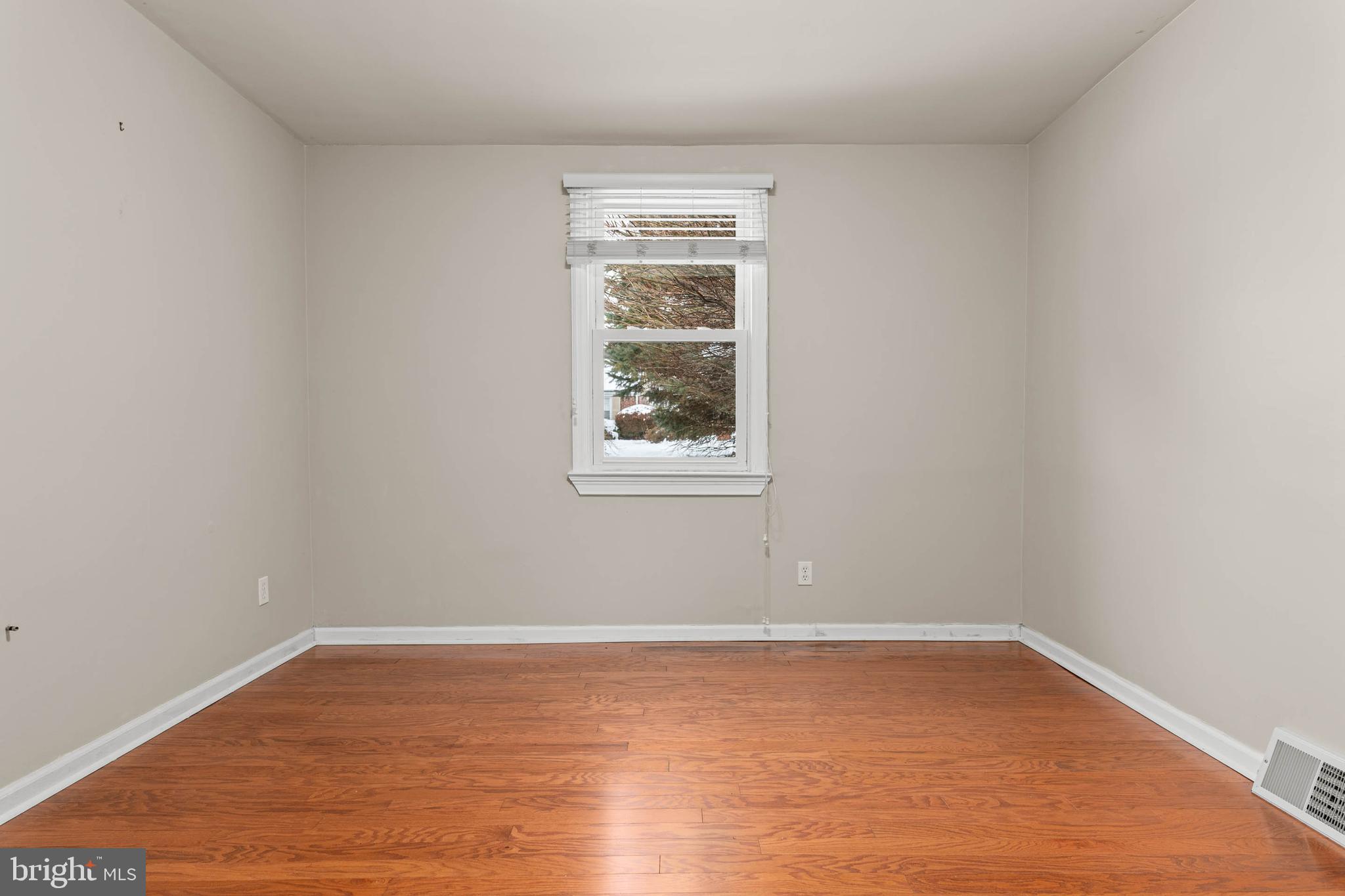 22 Longwood Drive Wayne, PA 19087 - Photo 11 of 28 wooden floor in an empty room with a window