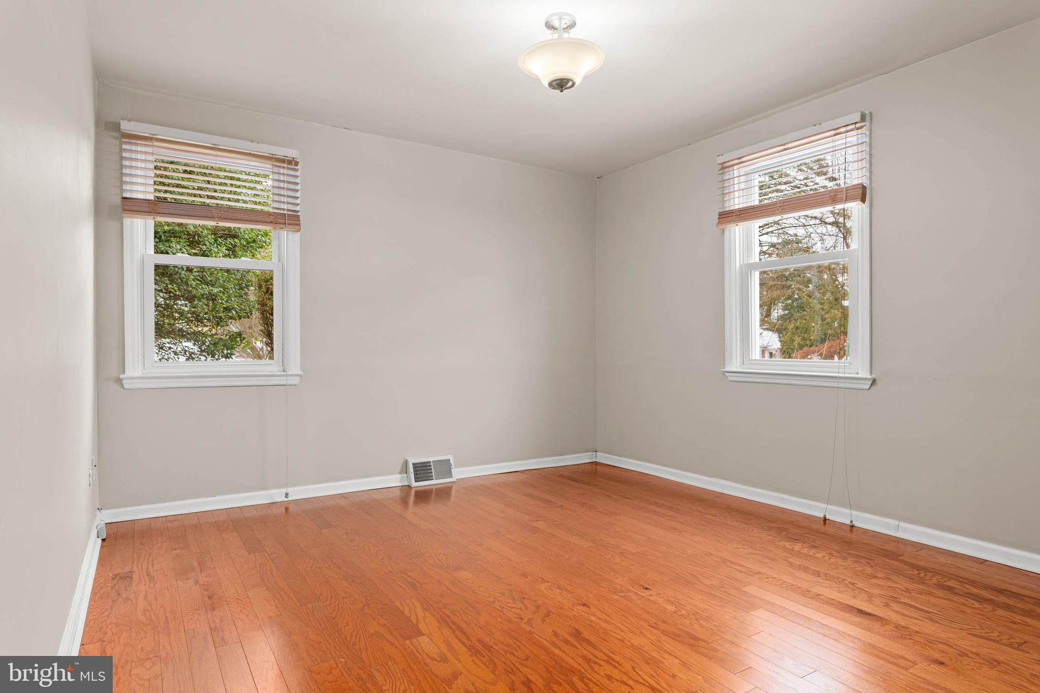 22 Longwood Drive Wayne, PA 19087 - Photo 12 of 28 a view of a big room with wooden floor and windows