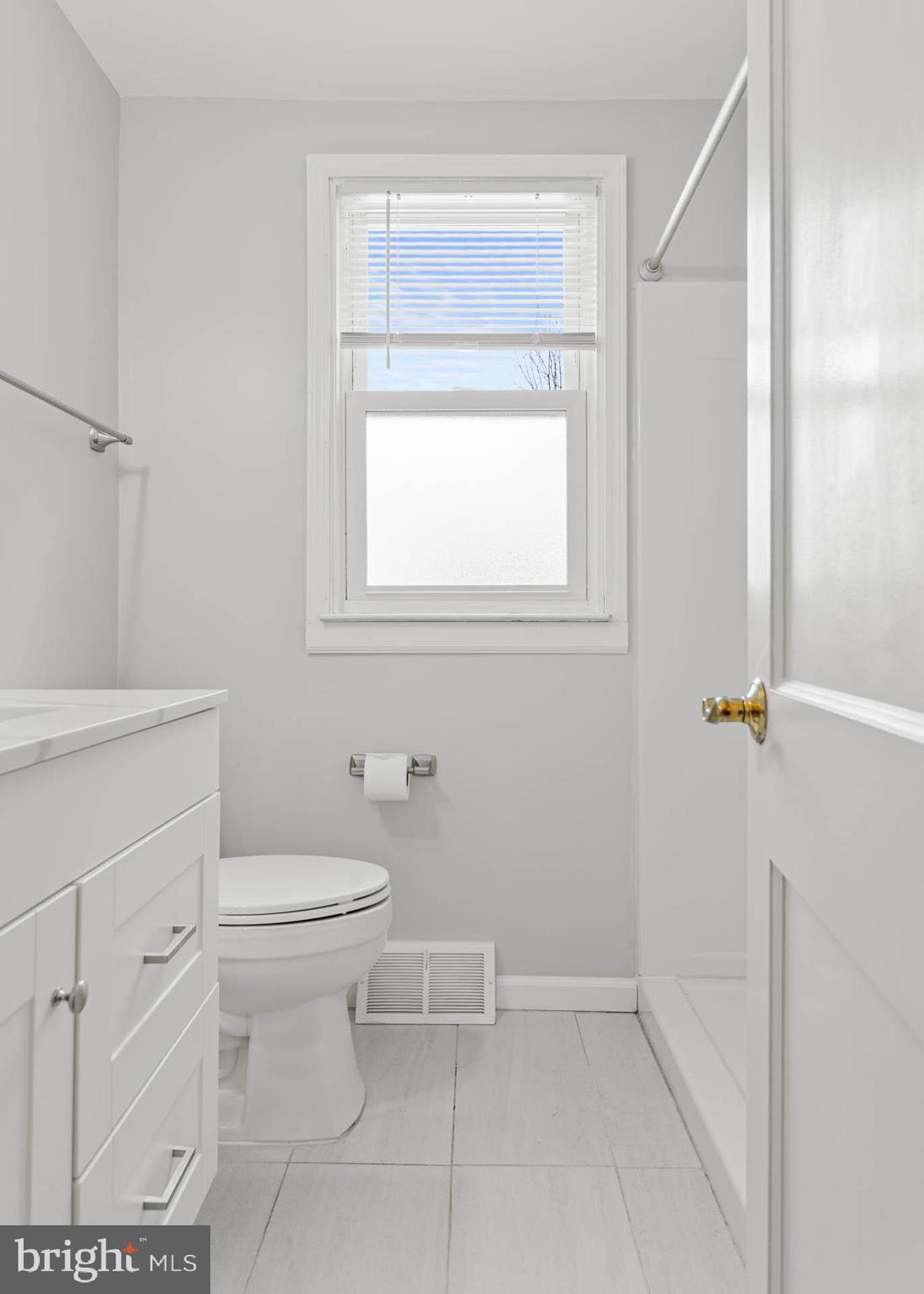 22 Longwood Drive Wayne, PA 19087 - Photo 14 of 28 a bathroom with a toilet a sink and a shower