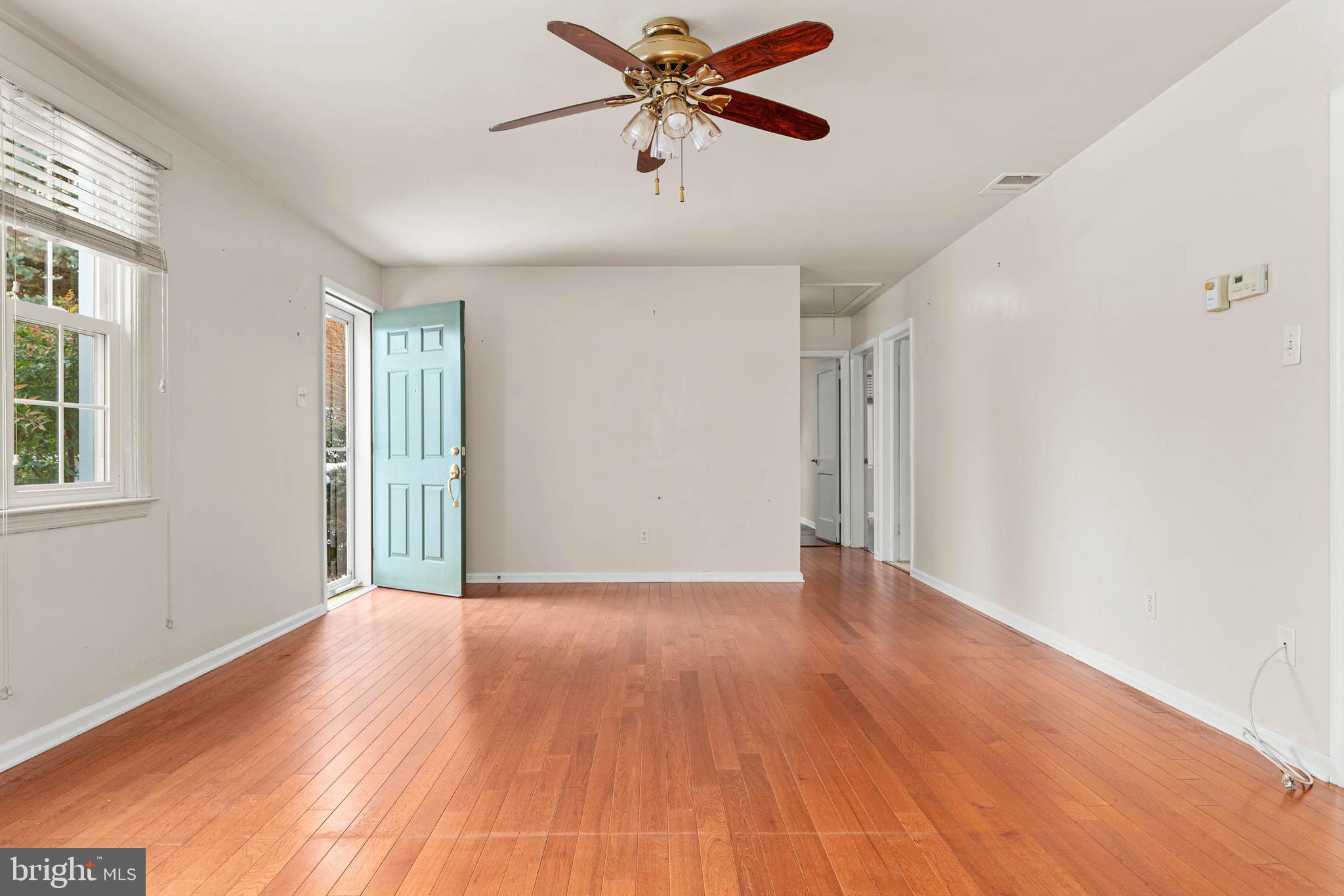 22 Longwood Drive Wayne, PA 19087 - Photo 9 of 28 a view of an empty room with window and wooden floor