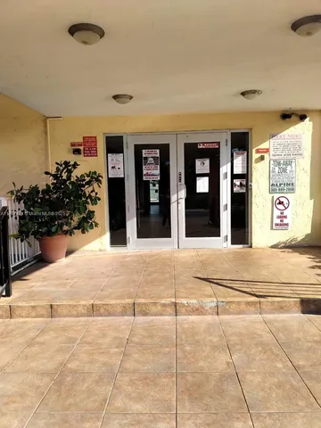 a view of a lake with houses in the back