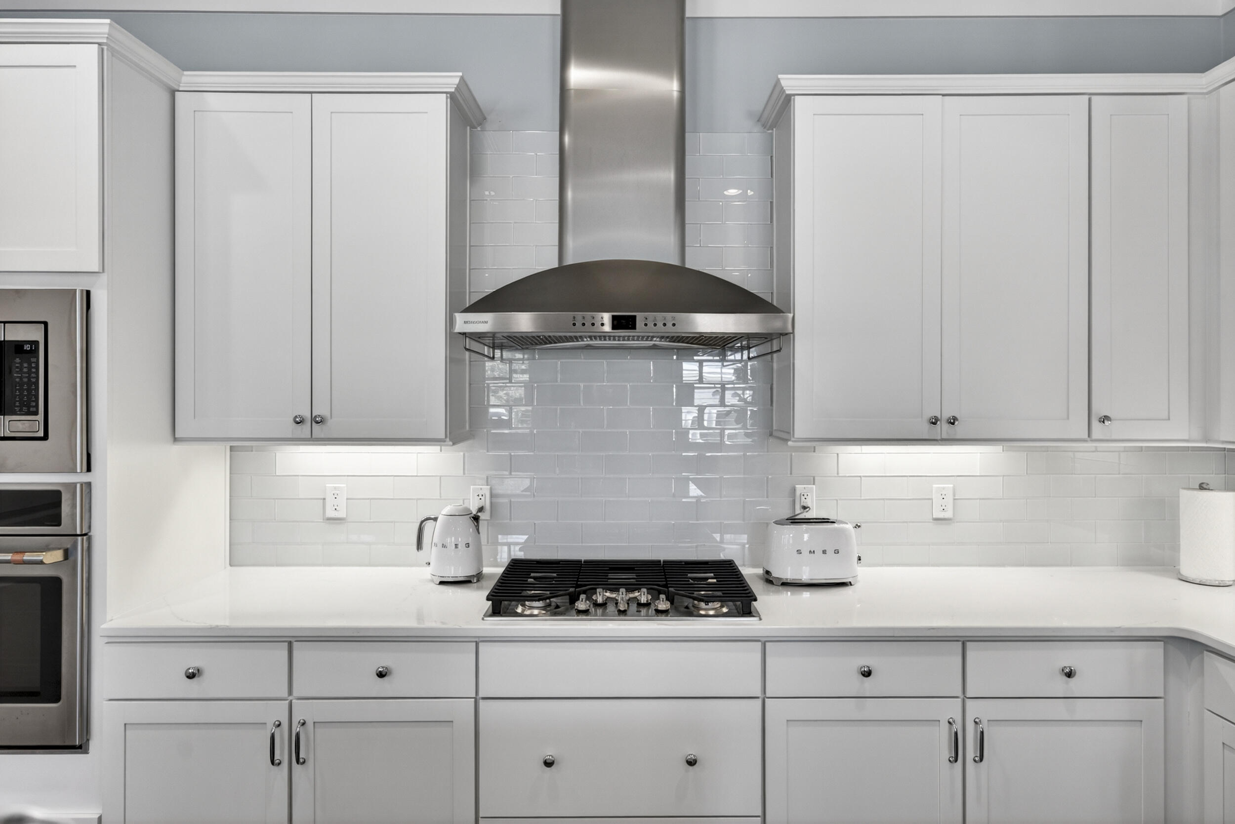 117 Prairie Pass Santa Rosa Beach, FL 32459 - Photo 15 of 56 a kitchen with a stove and white cabinets