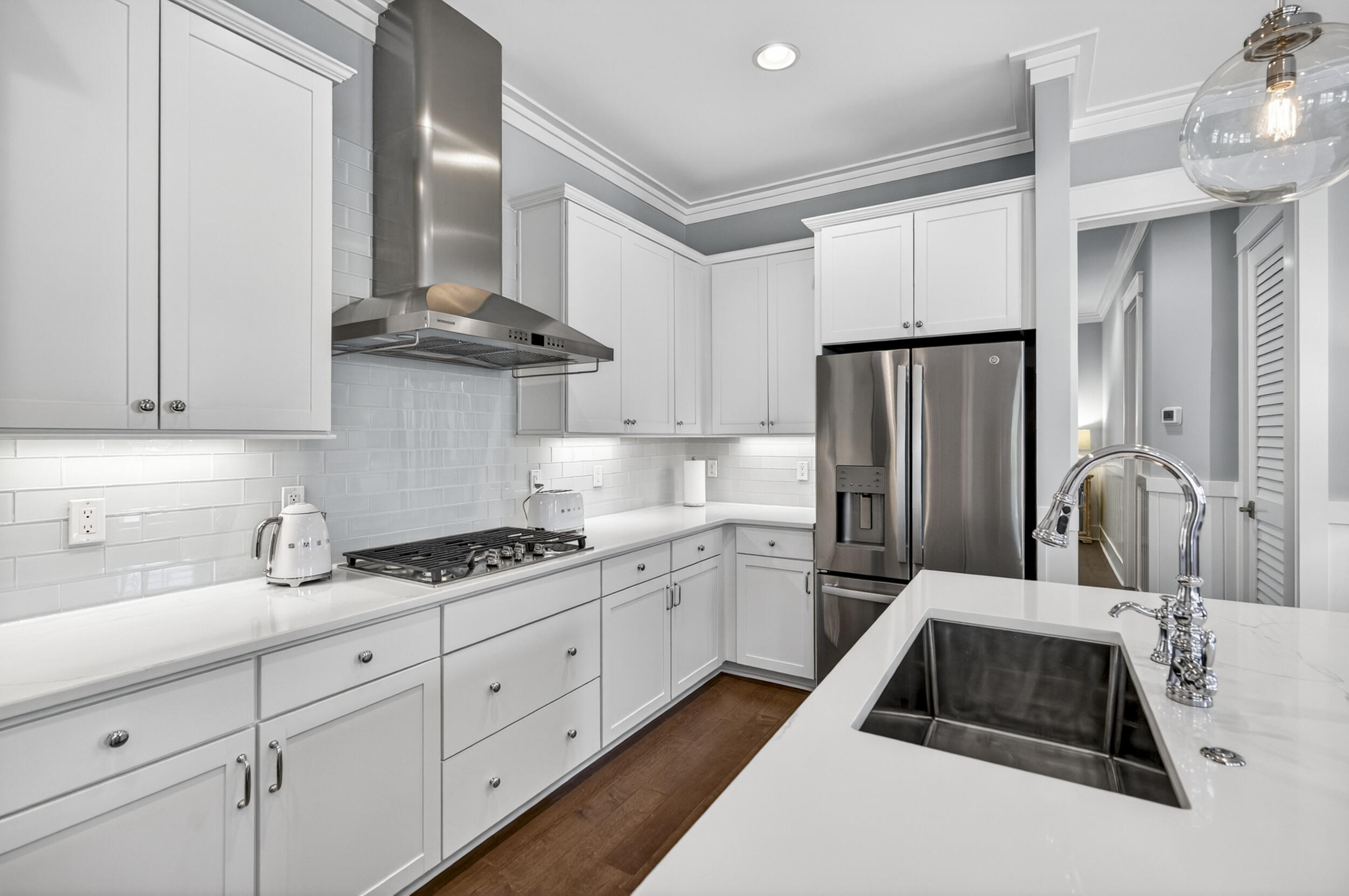117 Prairie Pass Santa Rosa Beach, FL 32459 - Photo 18 of 56 a kitchen with granite countertop a sink stove and refrigerator