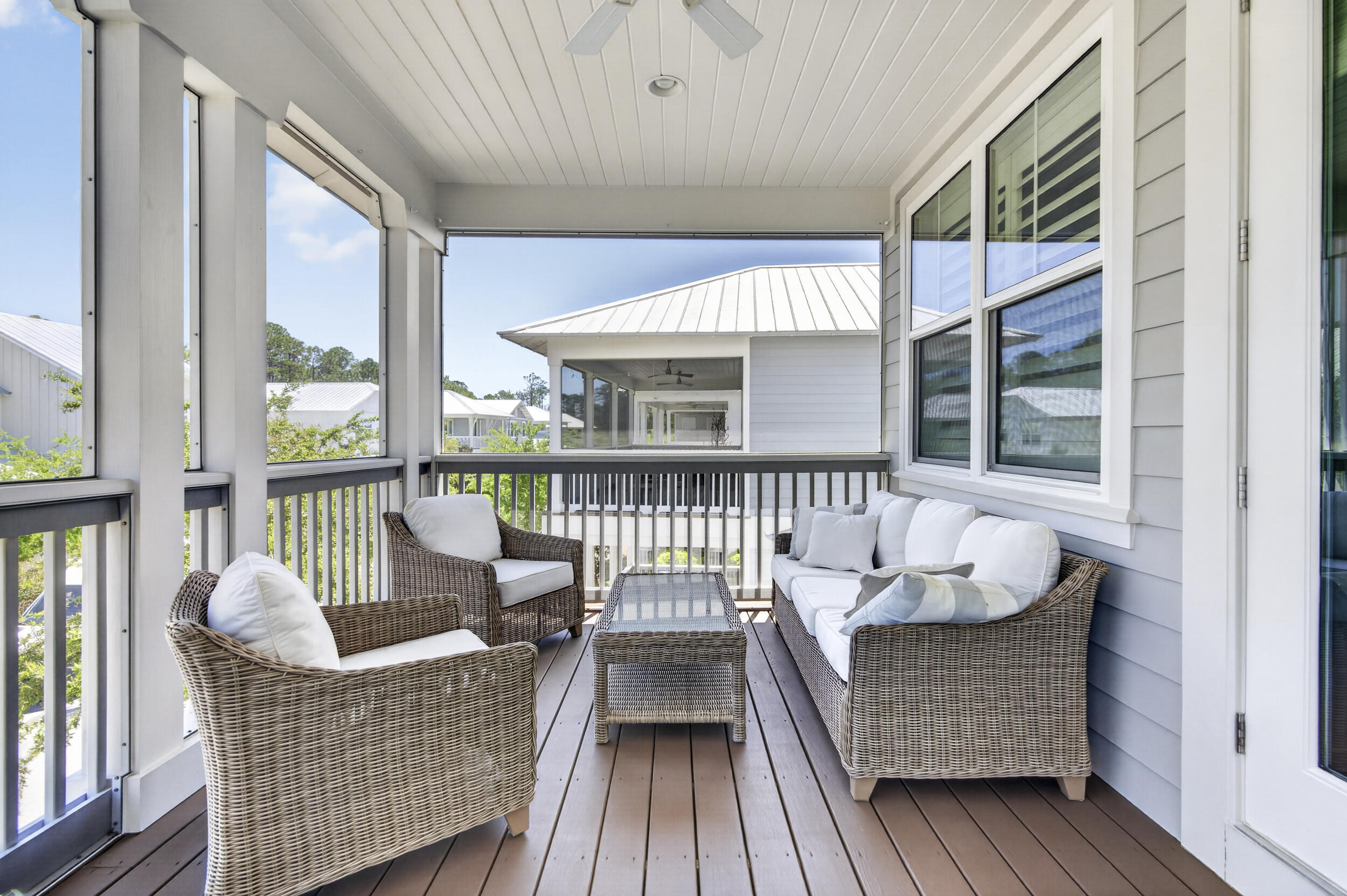 117 Prairie Pass Santa Rosa Beach, FL 32459 - Photo 30 of 56 a balcony with furniture and wooden floor