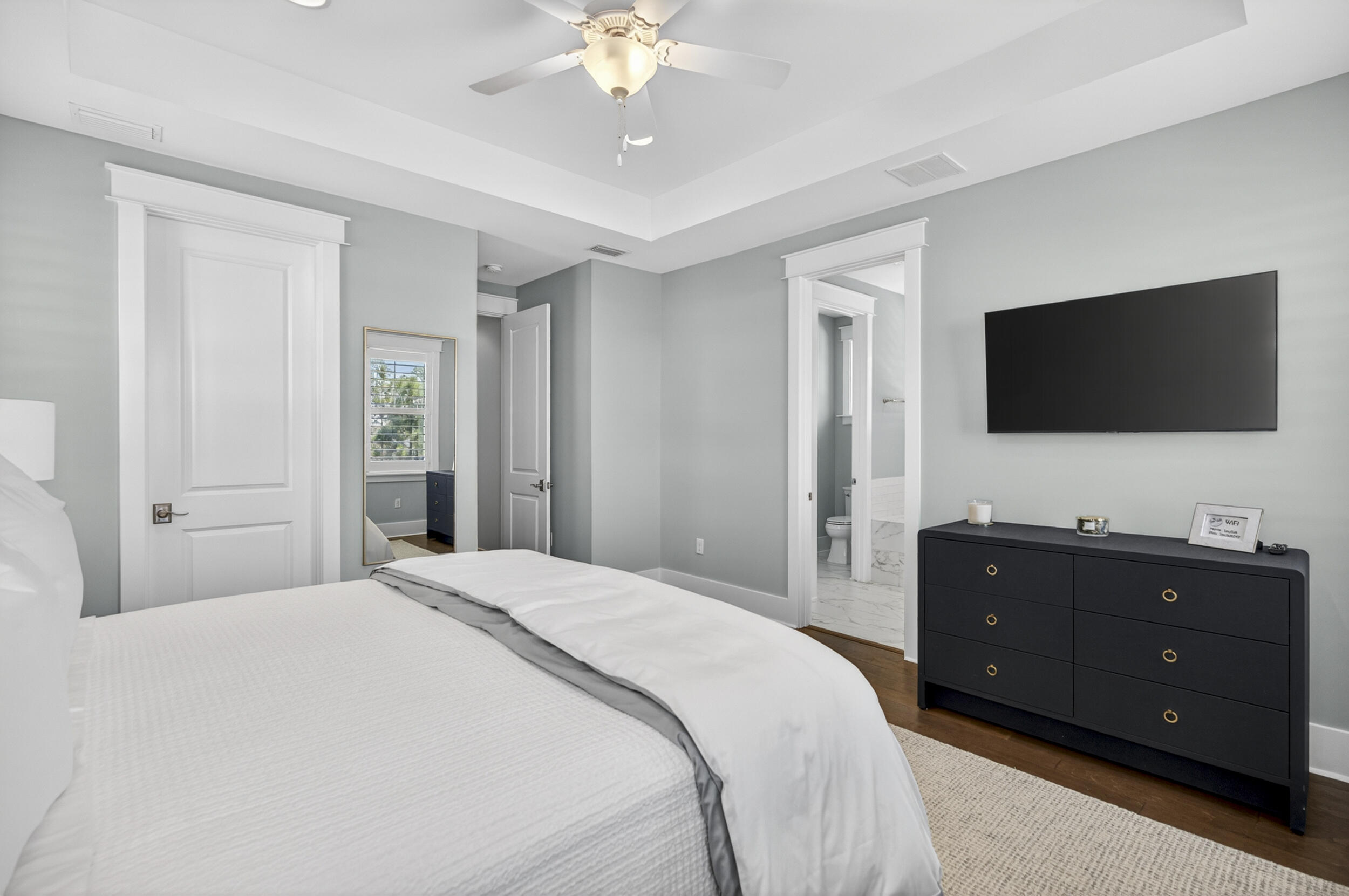 117 Prairie Pass Santa Rosa Beach, FL 32459 - Photo 33 of 56 a spacious bedroom with a bed and a flat screen tv