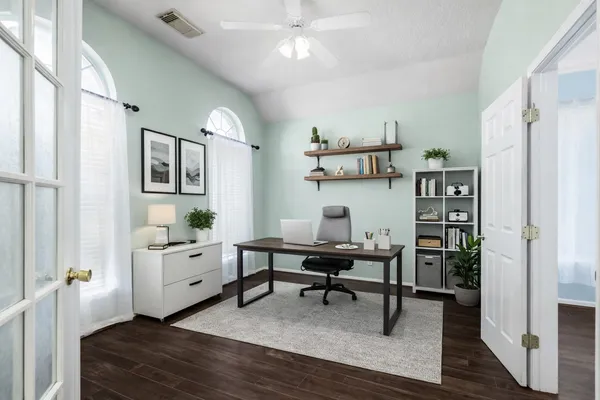 a bedroom with furniture and a window