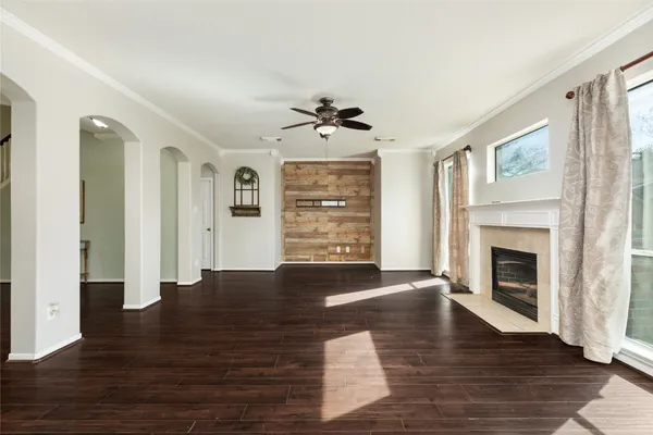 a living room with furniture fireplace and window