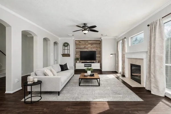 a large kitchen with a stove a sink a refrigerator and cabinets