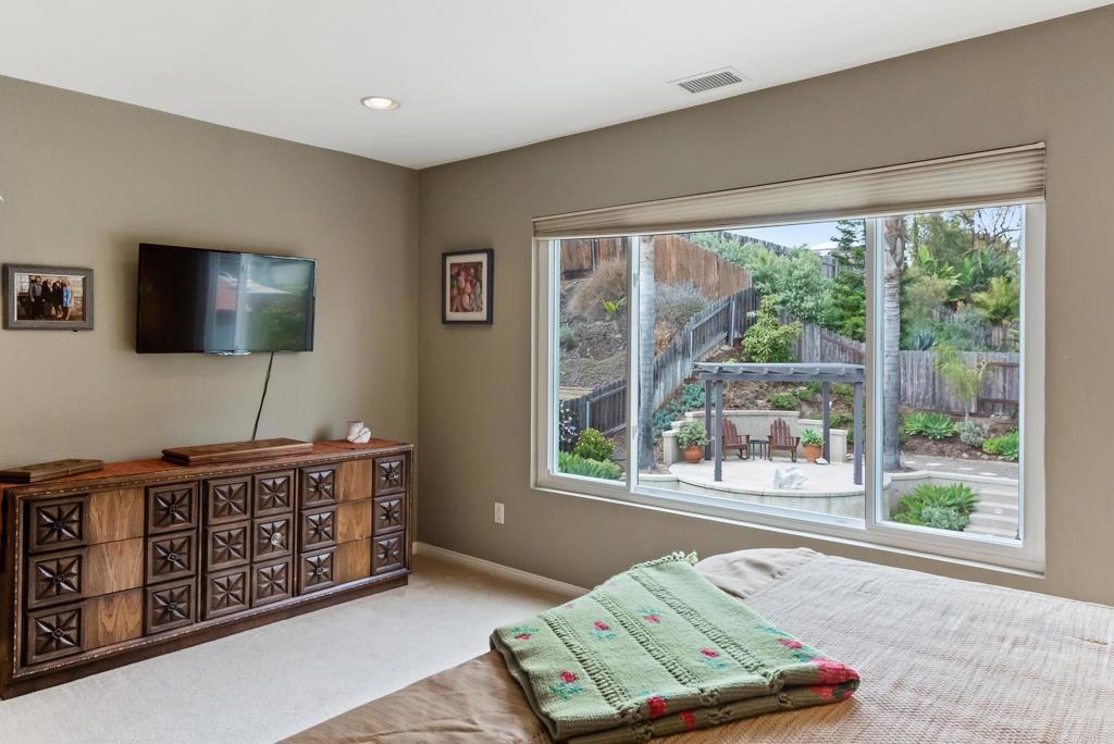 1462 Pegaso Street Encinitas, CA 92024 - Photo 15 of 36 a living room with furniture and a flat screen tv