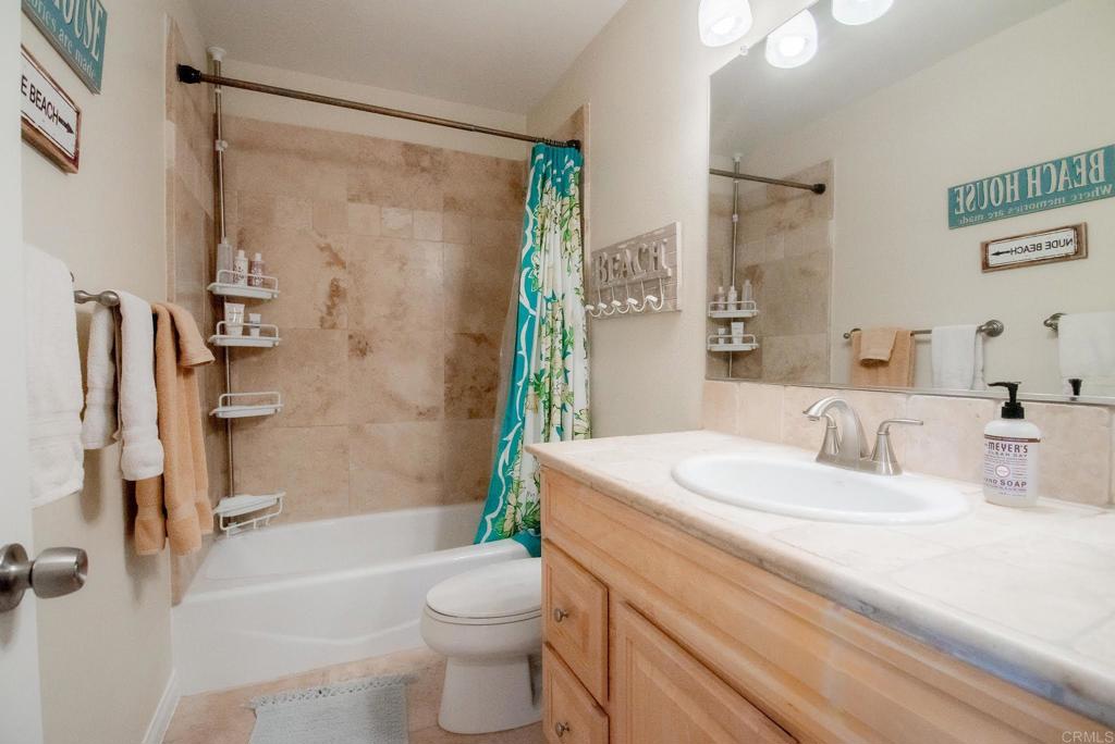 1462 Pegaso Street Encinitas, CA 92024 - Photo 20 of 36 a bathroom with a sink toilet and shower