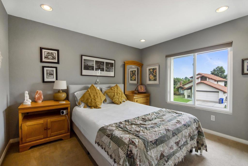 1462 Pegaso Street Encinitas, CA 92024 - Photo 24 of 36 a bedroom with a bed and a window