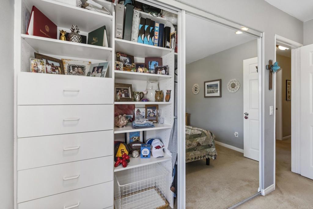 1462 Pegaso Street Encinitas, CA 92024 - Photo 27 of 36 a view of walk in closet with clothes and shoes