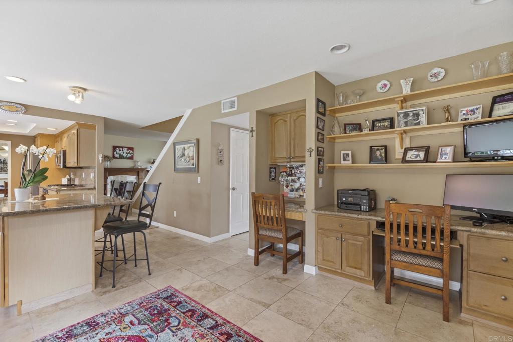 1462 Pegaso Street Encinitas, CA 92024 - Photo 36 of 36 a dining room with furniture and a book shelf