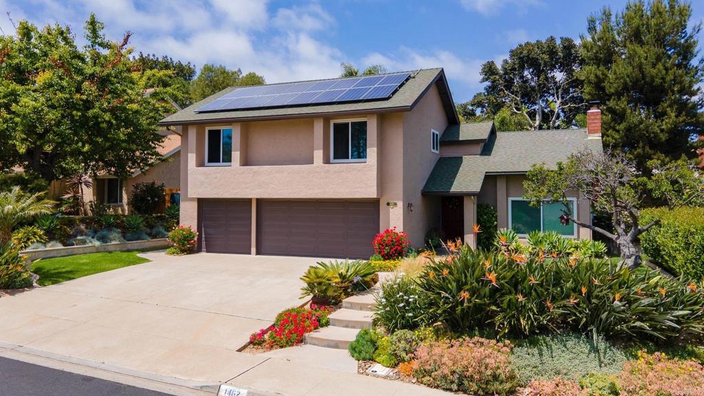 1462 Pegaso Street Encinitas, CA 92024 - Photo 4 of 36 a front view of a house with a garden