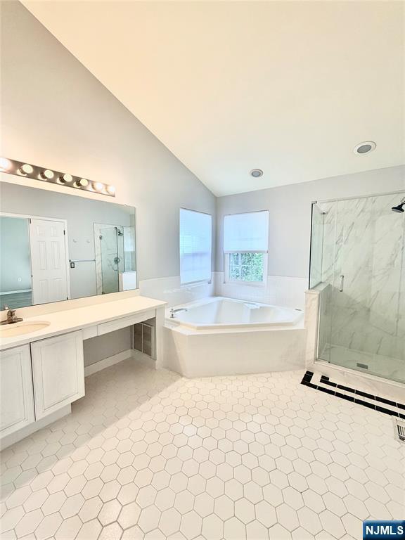 35 Harrier Court, Unit 35 Wayne, NJ 07470 - Photo 12 of 16 a spacious bathroom with a tub sink and mirror