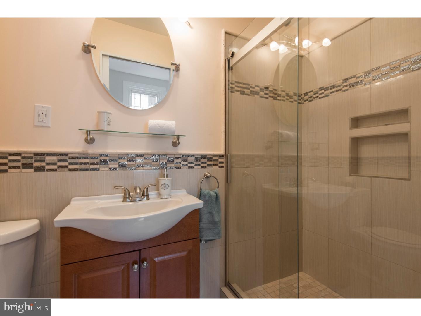 408 Lenox Road Havertown, PA 19083 - Photo 15 of 25 a bathroom with a sink a mirror a toilet and a mirror
