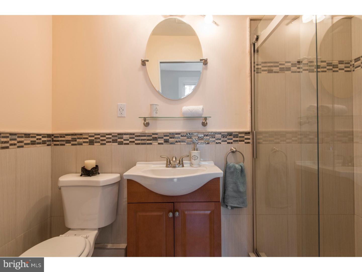 408 Lenox Road Havertown, PA 19083 - Photo 16 of 25 a bathroom with a sink and a mirror