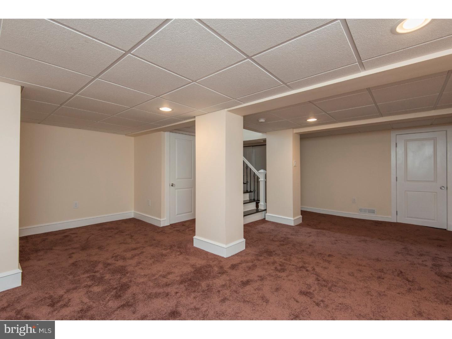 408 Lenox Road Havertown, PA 19083 - Photo 20 of 25 a view of an empty room with wooden floor