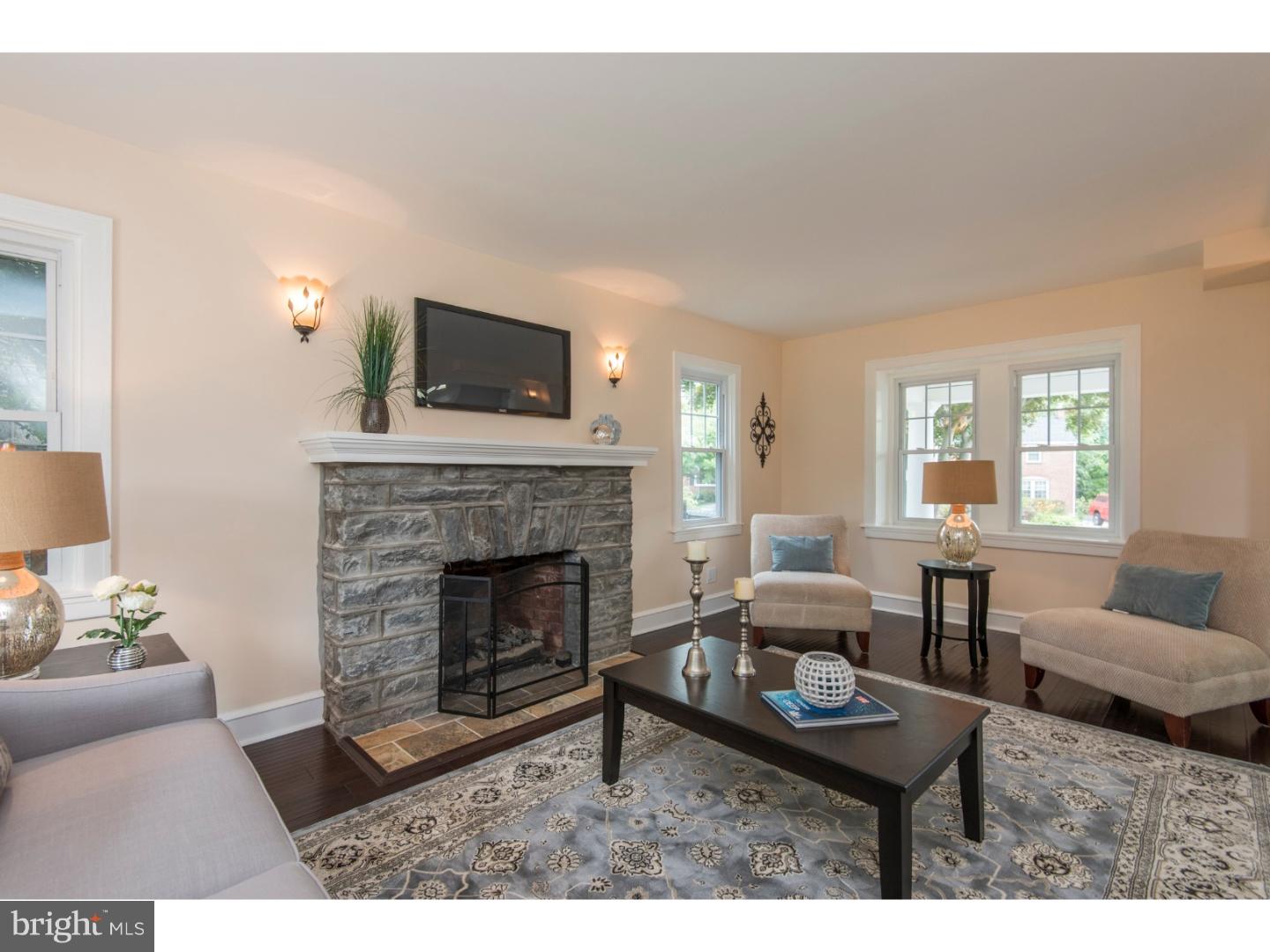 408 Lenox Road Havertown, PA 19083 - Photo 3 of 25 a living room with furniture and a fireplace