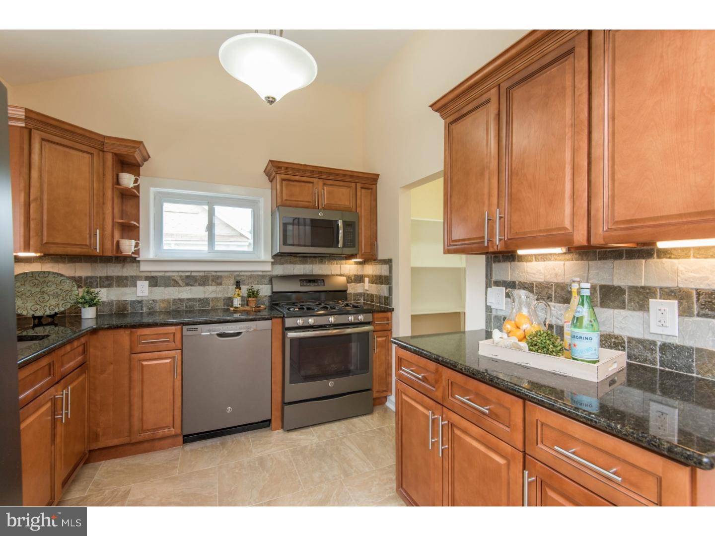 408 Lenox Road Havertown, PA 19083 - Photo 8 of 25 a kitchen with stainless steel appliances granite countertop a stove sink and microwave